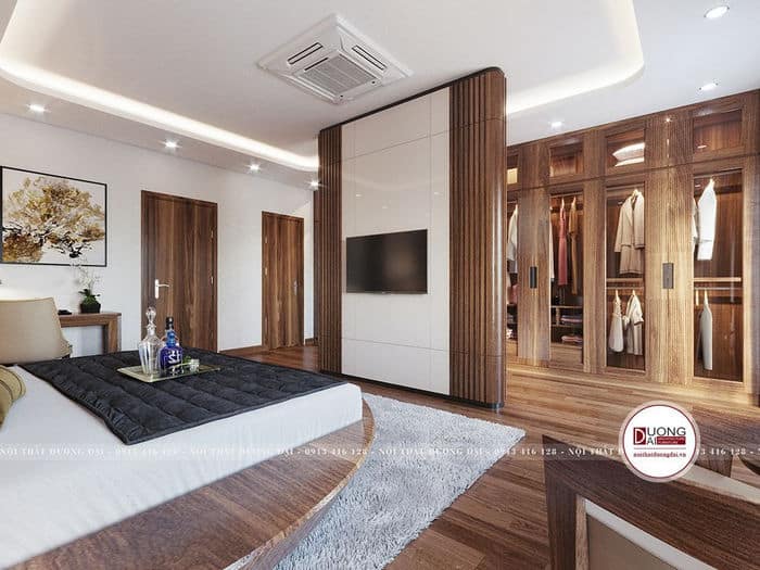 Thiết kế phòng ngủ với vách ngăn treo tivi lớn làm từ gỗ OAK
